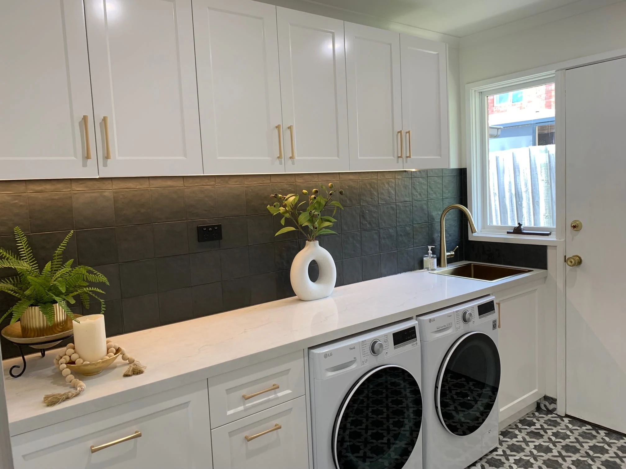 Custom laundry renovation Eltham Melbourne by Northside Joinery, two-pack shaker doors with 40mm stone benchtop
