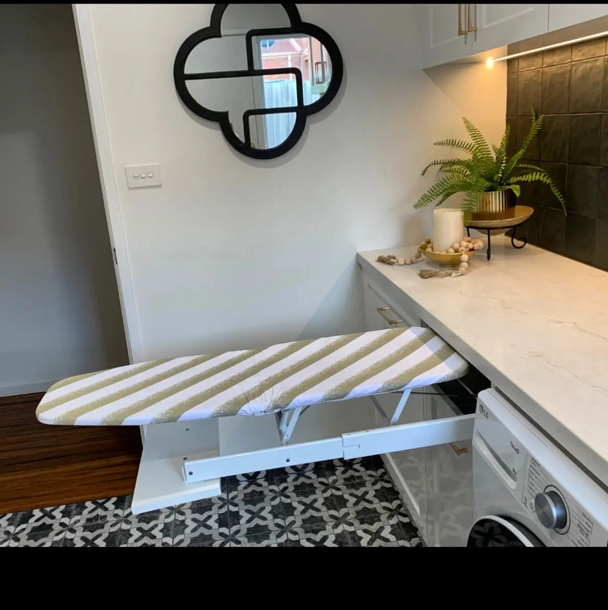 Pull-out ironing board integrated into custom laundry joinery Eltham Melbourne by Northside Joinery
