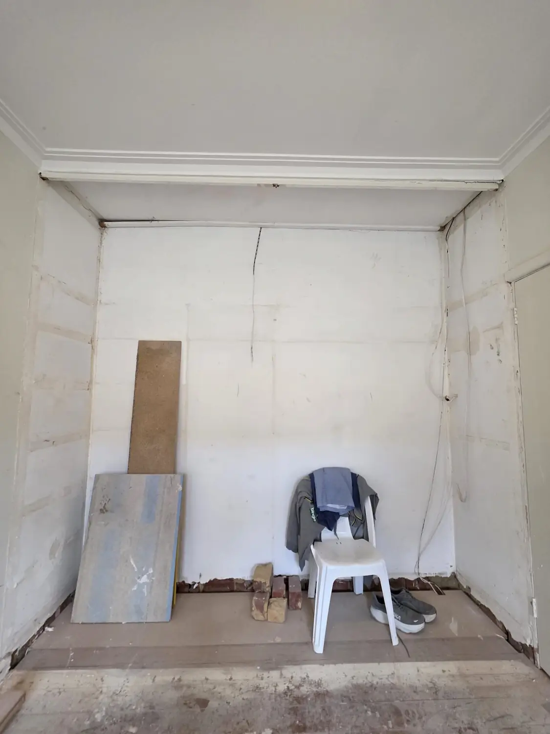 Empty bedroom recess in an East Melbourne apartment before floor to ceiling built in wardrobe installation by Northside Joinery Melbourne