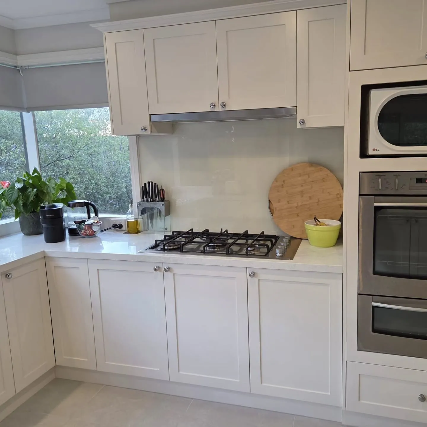 Natural white satin finish kitchen cabinetry